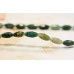 180-1006 Moss Agate <br>6x12 Faceted Oval Rice